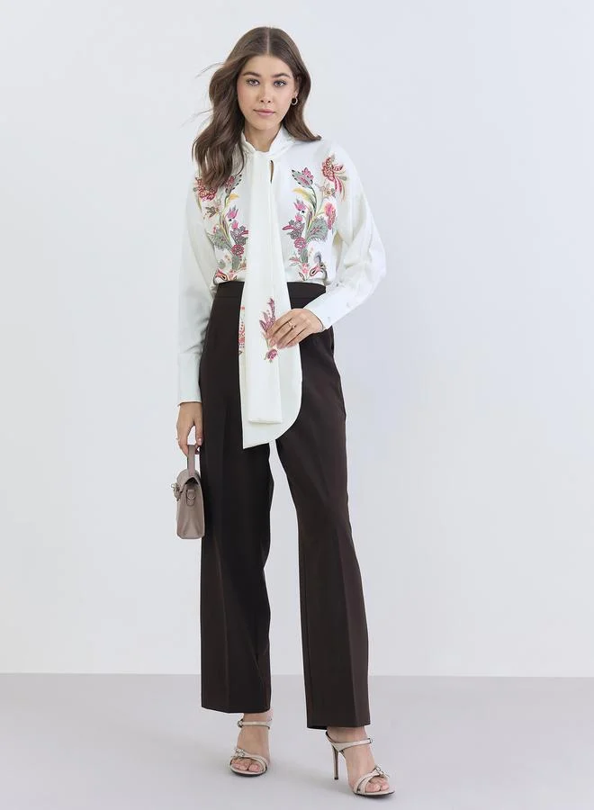 ستايلي بلوزة بقصة واسعة برباط عنق وطبعة زهور